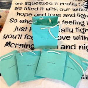 Tiffany & Co. Aqua Blue Shopping Bags. Approx 5”x6”. 5 bag set